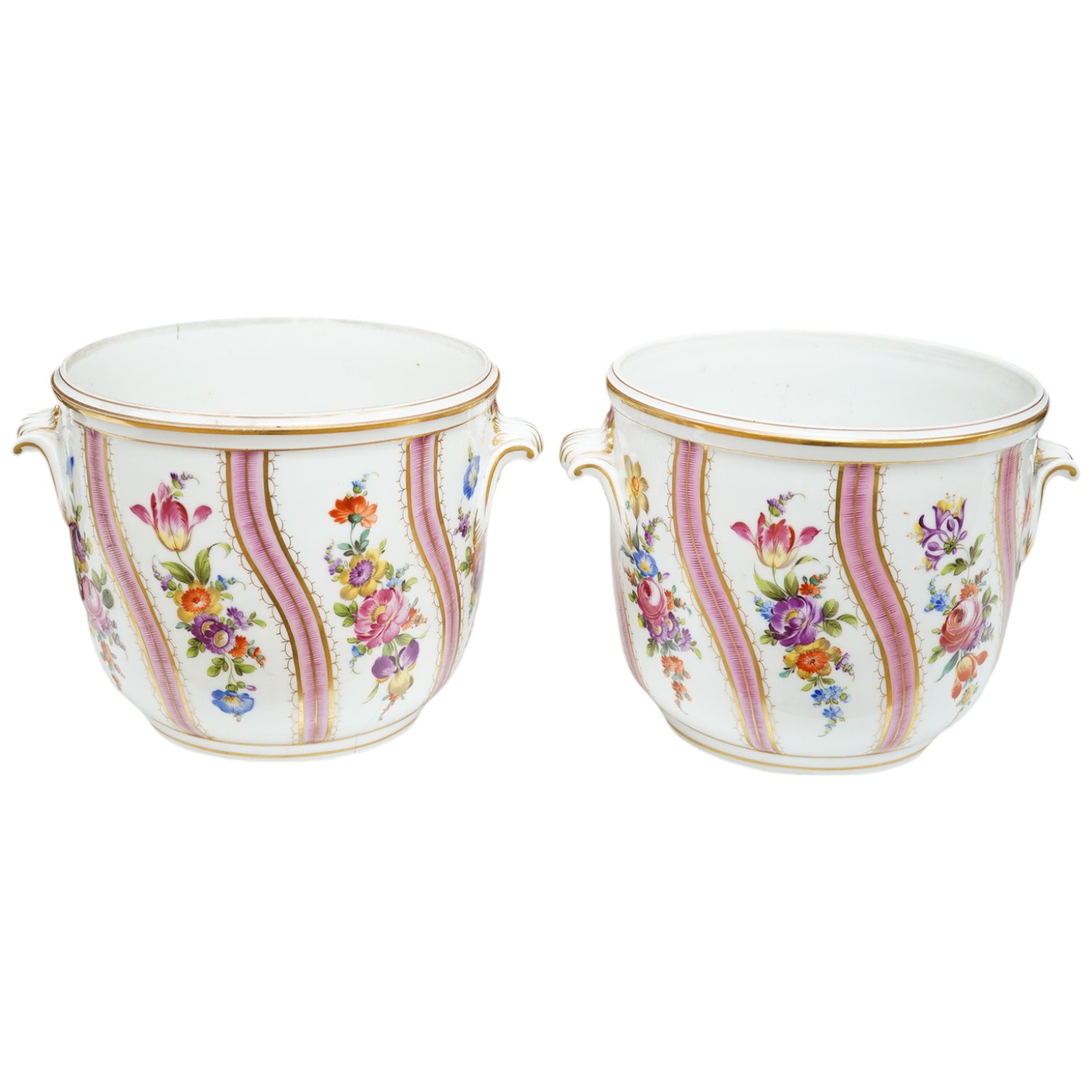 A pair of Dresden wine coolers with floral decoration, 15cm high, 18cm diameter. Condition poor to fair, cracks to the base of one.